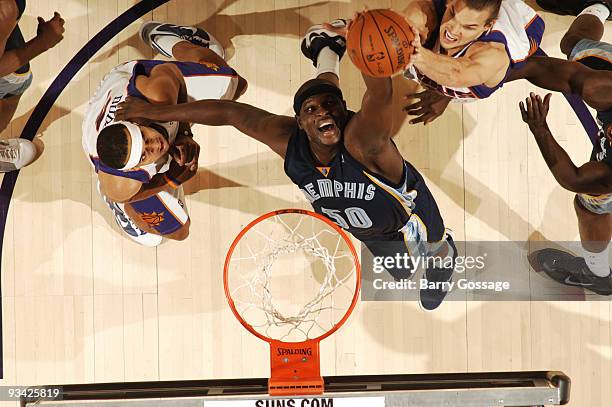 Zach Randolph of the Memphis Grizzlies tries to get a rebound away from Louis Amundson of the Phoenix Suns in an NBA Game played on November 25, 2009...
