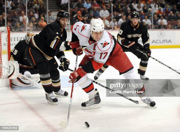 Rod Brind'Amour of the Carolina Hurricanes takes a pass in front of Steve Eminger and Corey Perry of the Anaheim Ducks during the second period at...