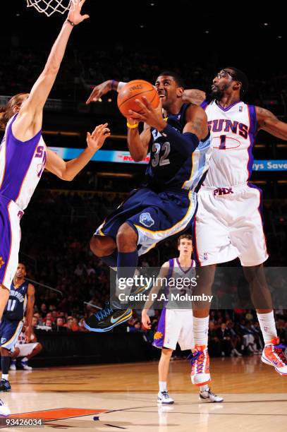 Mayo of the Memphis Grizzlies drives for a shot past Amar'e Stoudemire of the Phoenix Suns in an NBA Game played on November 25, 2009 at U.S. Airways...