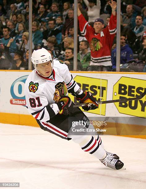 Blackhawks fan celebrates in the background after Marian Hossa of the Chicago Blackhawks scored a shorthanded goal against the San Jose Sharks during...
