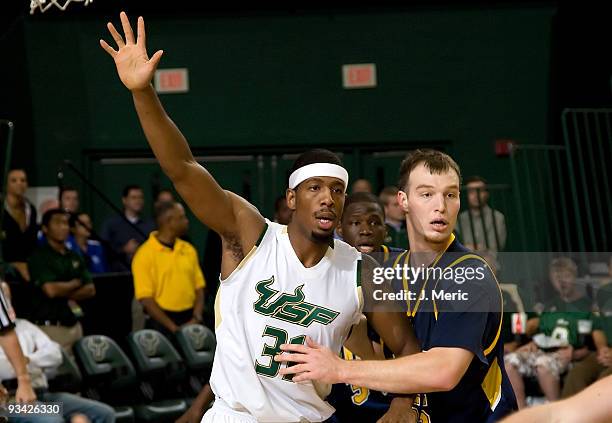 Jarrid Famous of the South Florida Bulls battles Brandon Parks of the Kent State Golden Flashes during the game at the SunDome on November 25, 2009...