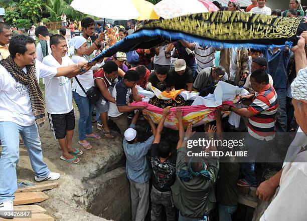 One of the five members of Mangudadatu clan is buried in the family cemetery in Buluan, Maguindanao province on November 26, 2009. The victims were...