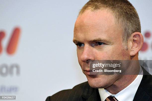 Marius Kloppers, chief executive officer of BHP Billiton Ltd., attends a news conference following the company's annual general meeting, in Brisbane,...