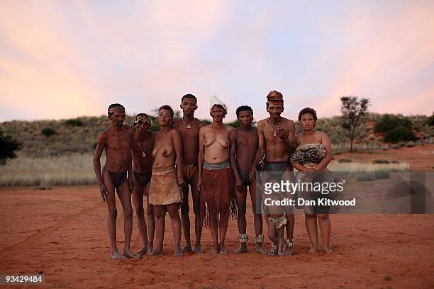 Group of San Bushmen from the Khomani San community pose for a photograph in the Southern Kalahari desert on October 16, 2009 in the Kalahari, South...