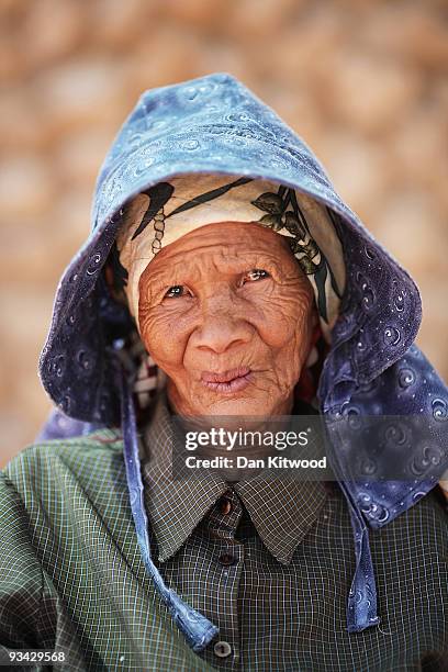 San Bushwoman Una 82, from the Khomani San community poses for a photograph in the Southern Kalahari desert on October 15, 2009 in the Kalahari,...