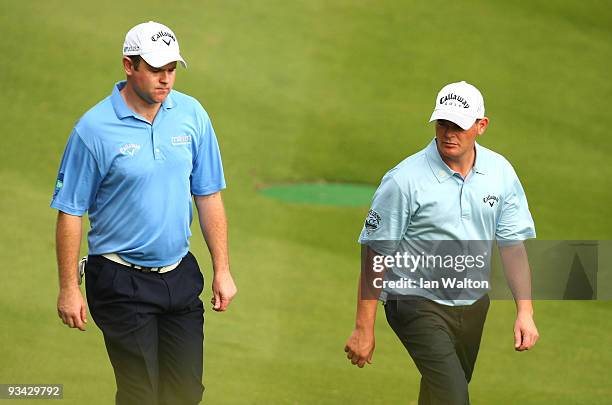 Alastair Forsyth and David Drysdale of Scotland during the Fourball on the first day of the Omega Mission Hills World Cup on the Olazabal course on...