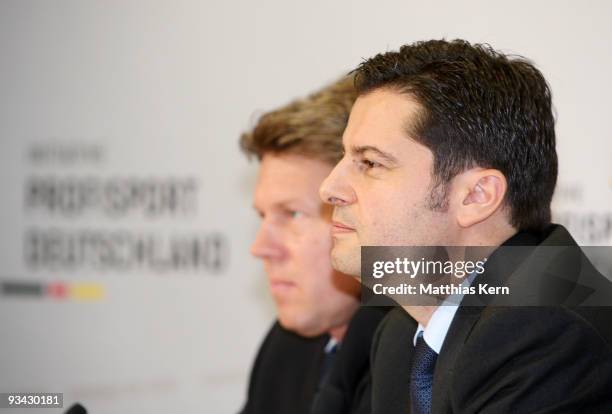 Gernot Tripcke , general manager of the German Ice Hockey League and Christian Seifert , general manager of the German Football League are seen...