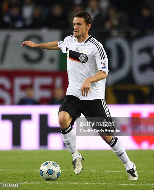 Christian Gentner runs with the ball during the FIFA 2010 World Cup Group 4 Qualifier match between Germany and Finland at the HSH Nordbank Arena on...