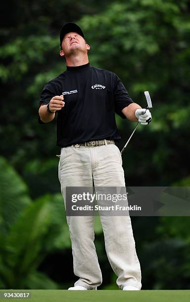 Alex Cejka of Germany reacts to a putt on the 12th hole during Fourball on the first day of the Omega Mission Hills World Cup on the Olazabal course...