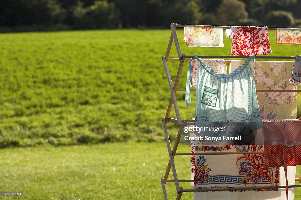 Clothes hanging on drying rack in rural setting