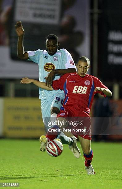 Kirk Hudson of Aldershot Town attempts to control the ball under pressure from Patrick Kanyuka of Northampton Town during the Coca Cola League Two...