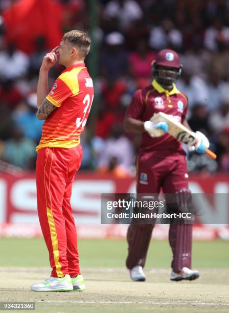 Sean Williams of Zimbabwe reacts as Evin Lewis of The West Indies scores runs of his bowling during The Cricket World Cup Qualifier between The West...