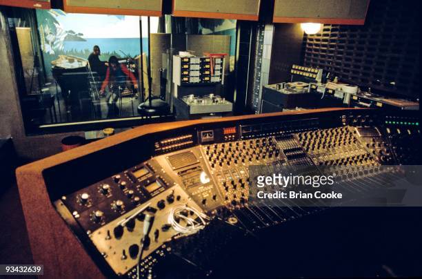 View of the control room of Studio 2 at Island Records' Basing Street Studios looking through the glass into the live room, showing mixing desk, tape...