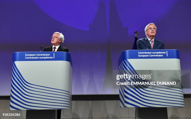 British Brexit Minister David Davis and EU chief negotiator Michel Barnier address a press conference after their meeting at the European Commission...