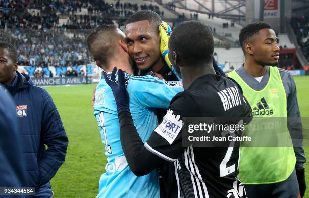 Marcelo Guedes of Lyon surrounded by goalkeeper Anthony Lopes and Ferland Mendy during the chaos following the French Ligue 1 match between Olympique...