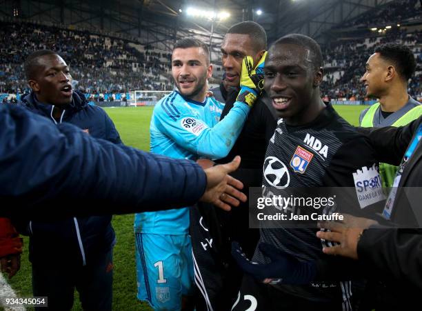 Marcelo Guedes of Lyon surrounded by goalkeeper Anthony Lopes and Ferland Mendy during the chaos following the French Ligue 1 match between Olympique...