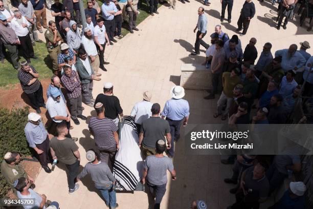 Family members and friends carry the body of Israeli Adiel Coleman during his funeral on March 19, 2018 in Kochav Hashahar settlement, West Bank....