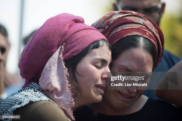 Ayelet , wife of Israeli Adiel Coleman, mourns over his grave during his funeral on March 19, 2018 in Kochav Hashahar settlement, West Bank. Hundreds...