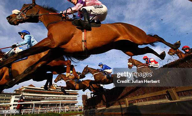 Mr Joshua Guerriero and Exmoor Ranger clear the water jump before wining The Racing UK Handicap Steeple Chase Race run at Newbury Racecourse on...