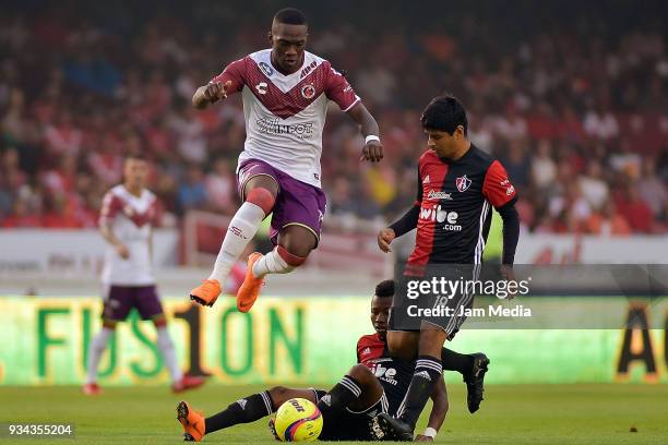 Miguel Murillo of Veracruz and Luis Robles of Atlas compete for the ball during the 12th round match between Veracruz and Atlas as part of the Torneo...