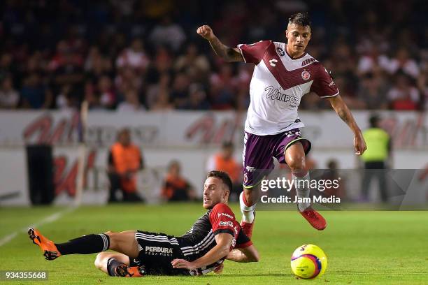 Jose Henriquez of Atlas and Richard Ruiz of Veracruz compete for the ball during the 12th round match between Veracruz and Atlas as part of the...