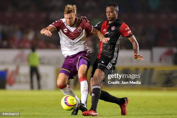 Cristian Menendez of Veracruz and Jaine Barreiro of Atlas fight for the ball during the 12th round match between Veracruz and Atlas as part of the...