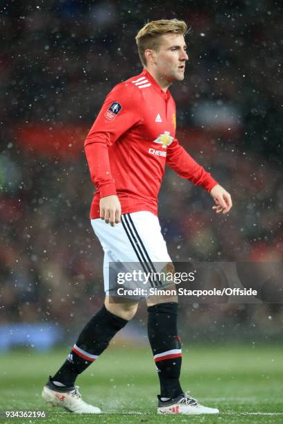 Luke Shaw of Man Utd looks on during The Emirates FA Cup Quarter Final match between Manchester United and Brighton and Hove Albion at Old Trafford...