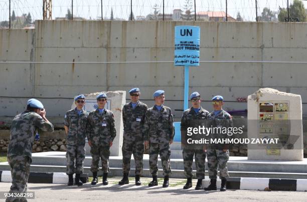 Peacekeeping force in Lebanon liaison take a picture as they attend the UNIFLIS's 40th anniversary celebration at its base in Lebanon's southern...