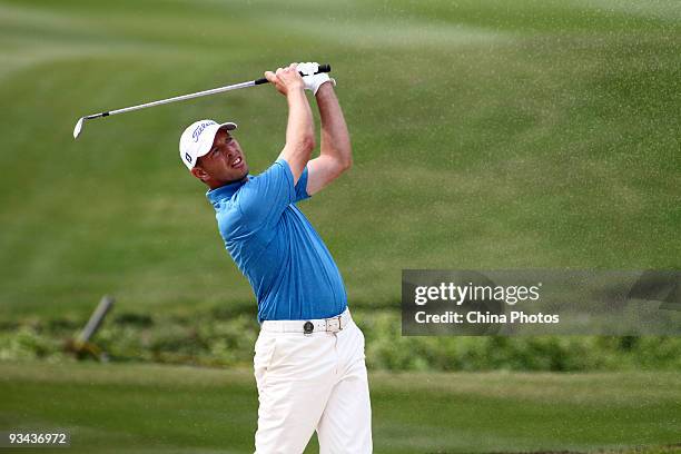 Soren Hansen of Denmark plays a shot on the 14th hole during Fourball on the first day of the Omega Mission Hills World Cup on the Olazabal course on...