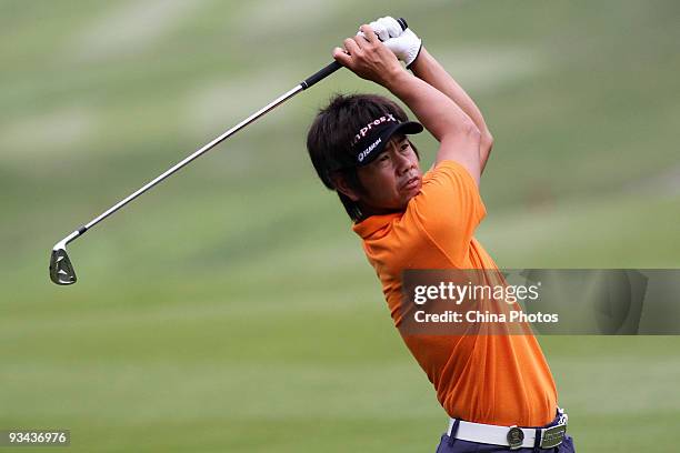 Hiroyuki Fujita of Japan plays a shot on the 16th hole during Fourball on the first day of the Omega Mission Hills World Cup on the Olazabal course...