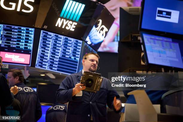 Trader works on the floor of the New York Stock Exchange in New York, U.S., on Monday, March 19, 2018. Stocks declined globally on Monday amid a...