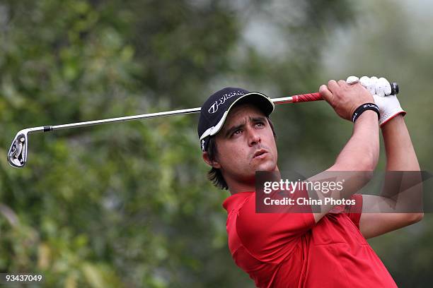 Rafa Echenique of Argentina plays a shot on the 15th hole during Fourball on the first day of the Omega Mission Hills World Cup on the Olazabal...