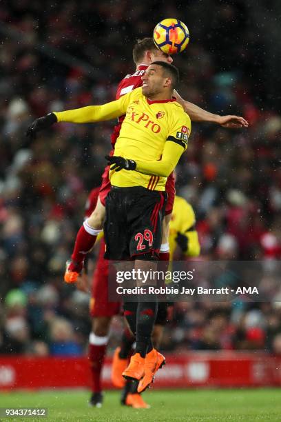 Etienne Capoue of Watford and James Milner of Liverpool during the Premier League match between Liverpool and Watford at Anfield on March 17, 2018 in...