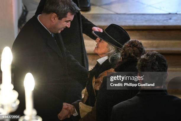 Widow Karin Rauch accepts condolences from Bavarian Prime Minister Markus Soeder during the memorial service for Siegfried Rauch at St Ulrich Church...