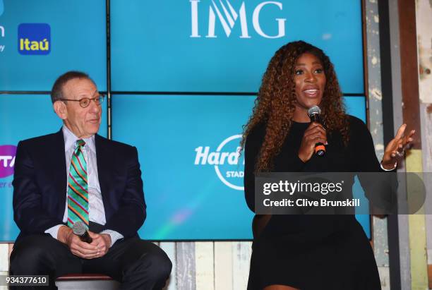 Serena Williams of the United States speaks at the press conference watched by Stephen Ross, Miami Dolphins owner prior to the ground breaking...