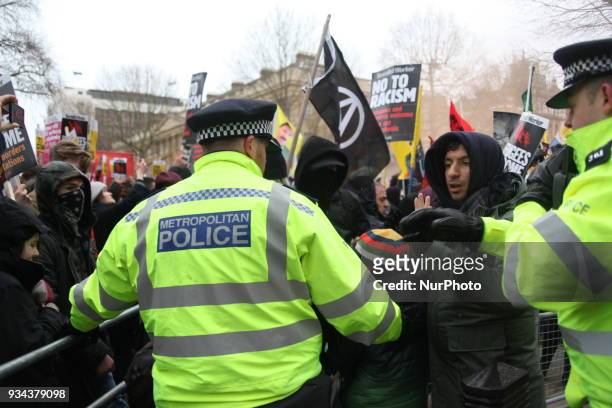 Police against Protesters outside Downing Street at the UN Anti-Racism Day March in London, UK, on 17 March 2018. The annual Stand Up To Racism...