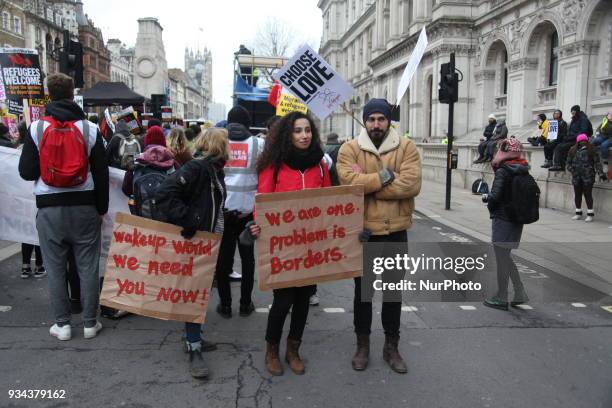 Protester at UN Anti-Racism Day March outside Downing Street, London, on 17 March 2018. The annual Stand Up To Racism demonstration is held on United...