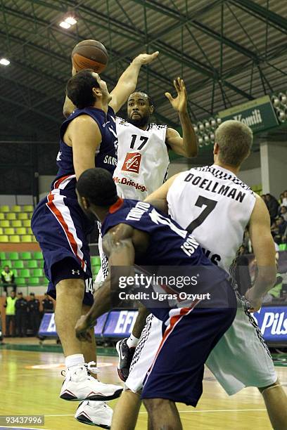 Anthony Dobbins, #17 of Entente Orleanaise competes with and Justin Doellman, #7 of Entente Orleanaise competes with and Kaya Peker, #14 of Efes...