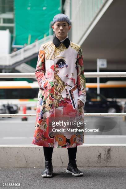 Guest is seen wearing an anime design print outfit with black/white split-toe shoes during the Amazon Fashion Week TOKYO 2018 A/W on March 19, 2018...
