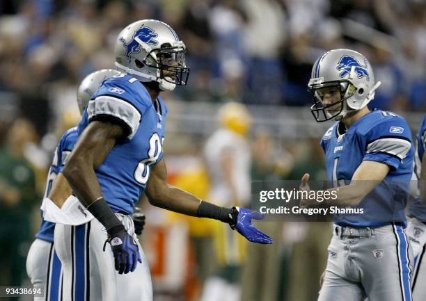 Calvin Johnson of the Detroit Lions celebrates a first quarter touchdown with Jason Hanson while playing the Green Bay Packers on November 26, 2009...