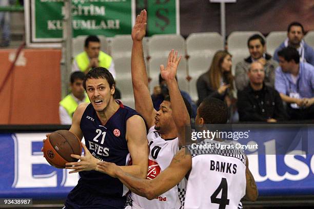 Bostjan Nachbar, #21 of Efes Pilsen Istanbul competes with and Cedrick Bank, #4 of Entente Orleanaise competes with in action during the Euroleague...