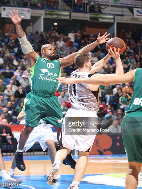 Bojan Popovic, #4 of Lietuvos Rytas competes with Omar Cook, #00 of Unicaja in action during the Euroleague Basketball Regular Season 2009-2010 Game...
