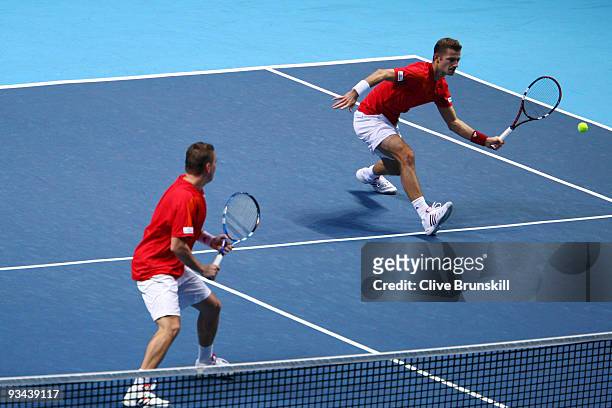 Michal Mertinak of Slovakia plays with Frantisek Cermak of Czech Republic during the men's doubles round robin match against Mariusz Fyrstenberg of...