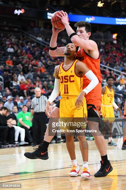 Oregon State forward Drew Eubanks grabs the ball from USC guard Jordan McLaughlin during the quarterfinal game of the mens Pac-12 Tournament between...