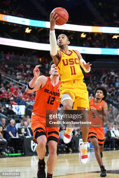 Guard Jordan McLaughlin drives to the basket during the quarterfinal game of the mens Pac-12 Tournament between the Oregon State Beavers and the USC...