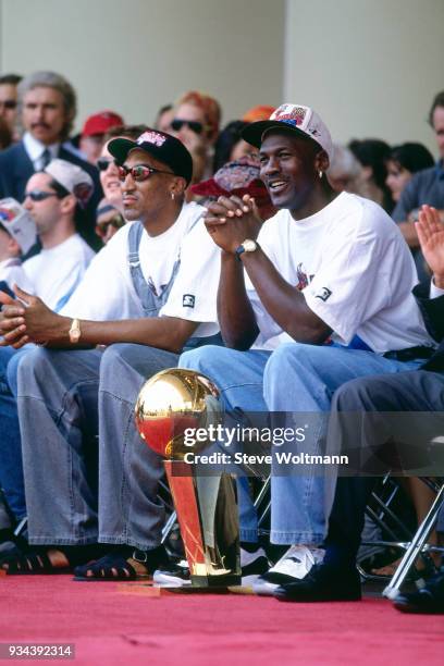 Michael Jordan and Scottie Pippen of the Chicago Bulls celebrates at the Bulls 1996 NBA Championship parade on June 18, 1996 in Chicago, Illinois....