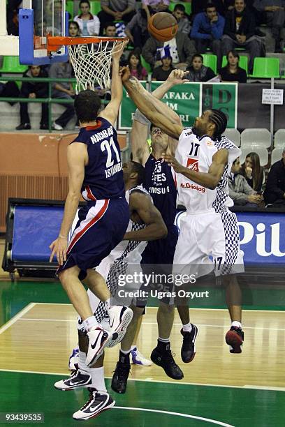 Anthony Dobbins, #17 of Entente Orleanaise competes with and Daniel Satiago, #25 of Efes Pilsen Istanbul competes with in action during the...