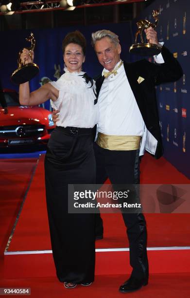 Designer Wolfgang Joop and actress Jessica Schwarz pose with their awards at the Bambi Awards 2009 Show at the Metropolis Hall at the Filmpark...