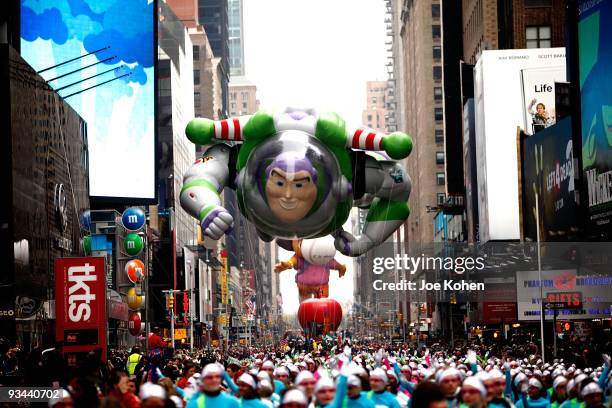 Buzz Lightyear balloon floats thru Times Sq during the 83rd annual Macy's Thanksgiving Day Parade on the streets of Manhattan on November 26, 2009 in...