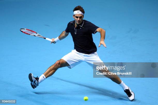 Roger Federer of Switzerland returns the ball during the men's singles round robin match against Juan Martin Del Potro of Argentina during the...